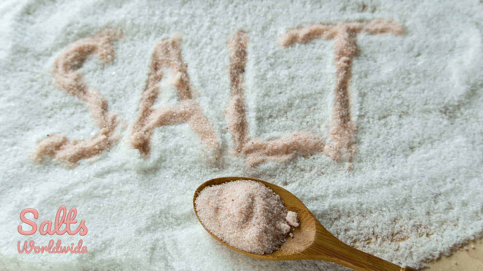 Pink salt vs. Regular salt - Regular salt with Pink salt and Spoon